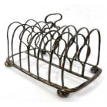 A George IV silver toast rack of oblong form supported on four bun feet of six divisions and a