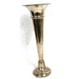 A hallmarked silver trumpet vase of plain tapering form (loaded), hallmarked Birmingham 1962, makers