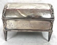 An Edwardian silver jewellery box, the dome shaped lid having a central full length hinge and