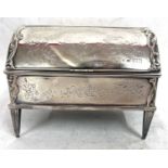 An Edwardian silver jewellery box, the dome shaped lid having a central full length hinge and