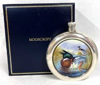 A Moorcroft silver and enamel Meganser hip flask 28/50, designed by W Creed, "boxed" with a small