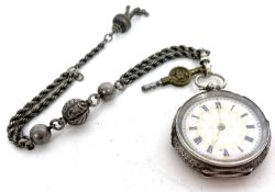 A white metal pocket watch and chain, the pocket watch is stamped in the case back 0.935 and has a