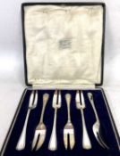 A cased set of six George V silver pastry forks, London 1924, makers mark for Josiah Williams & Co