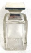 A George V glass and silver mounted spirit decanter, the plain glass body with a square shaped