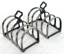 A pair of Art Deco small silver toast racks, each with four hoop divisions and having a trefoil