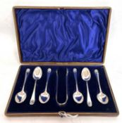 Cased Victorian teaspoon and tong set to include six shell pattern teaspoons and matching tongs,