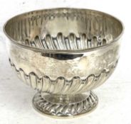 An Edwardian silver pedestal bowl, the body with partial half fluted wrythen design supported on a