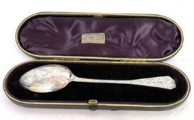 A cased William IV spoon overall decorated with bright cut decoration around initials, having a
