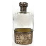 Edwardian silver and glass spirit flask, the glass flask with a faceted cut body, a screw top and