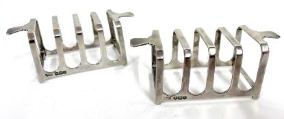 Pair of George VI silver toast racks of angular design with four divisions and twin handles,
