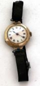 A 9ct gold ladies wrist watch, hallmarked on the inside of the case back, it has a manually crown