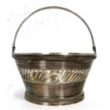 An antique Dutch silver small sugar basket, circa 1900, a reeded and pierced design with swing