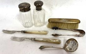 Mixed Lot: Hallmarked silver sifting spoon, two glass table jars with silver lids, a mother of pearl