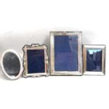 Four silver photograph frames to include a large rectangular frame with easel back, Birmingham 1917,