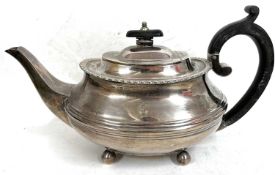 A heavy Edwardian silver teapot rounded oblong form, gadrooned rim and part reeded body having