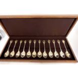 Cased set of twelve RSPB spoon collection comprising twelve silver spoons each terminal inset with a