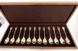Cased set of twelve RSPB spoon collection comprising twelve silver spoons each terminal inset with a