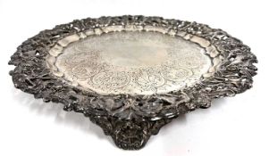 An antique silver plated salver/tray, having a heavy cast pierced border decorated with archers,