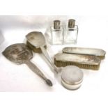 An Art Deco silver backed/topped dressing table wares to include hand mirror, hairbrush, two clothes