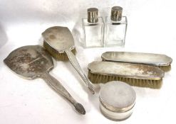 An Art Deco silver backed/topped dressing table wares to include hand mirror, hairbrush, two clothes