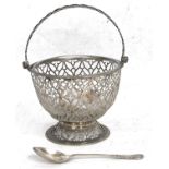 A George III silver sugar basket of squat circular form, overall pierced with lattice design, one