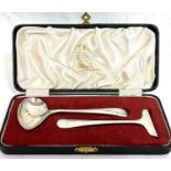 A cased silver child's spoon and pusher, Sheffield 1960/61, makers mark Viners Ltd