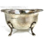 A George VI silver sugar bowl of oval form having a wavey rim and supported on four curved feet,