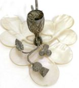 An antique silver and mother of pearl chamber stick circa 1900, the mother of pearl base carved
