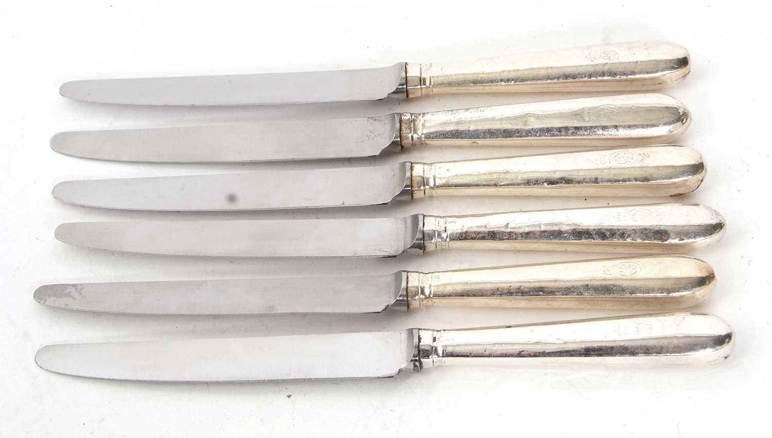 Six silver handled table knives, makers mark rubbed, London assay, makers mark showing as William