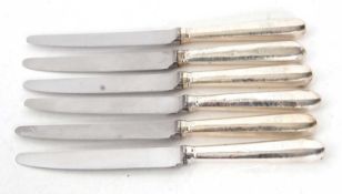 Six silver handled table knives, makers mark rubbed, London assay, makers mark showing as William