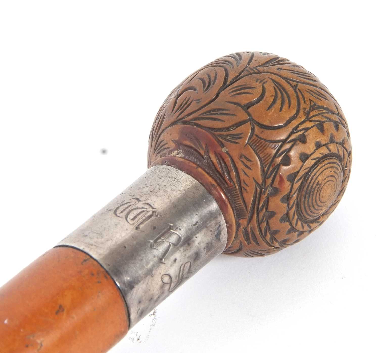 An antique walking stick with ball finial, carved with foliate and geometric designs with a metal - Image 5 of 10
