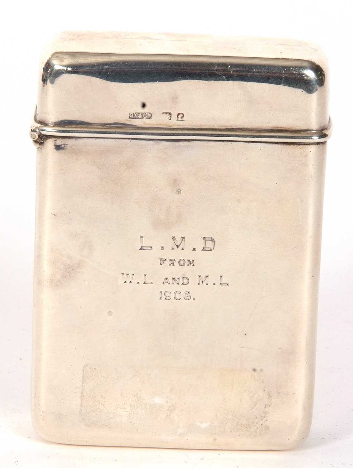 An Edwardian silver cigar case of plain polished rectangular form, hinged lid with personalised