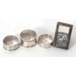 Mixed Lot: Three various hallmarked silver serviette rings, 68gms together with a small silver