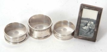 Mixed Lot: Three various hallmarked silver serviette rings, 68gms together with a small silver