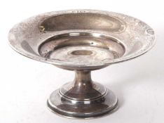 George VI silver tazza of plain circular form on a pedestal to a spreading foot, 16cm diameter,