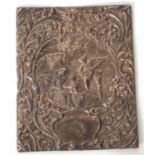 A hallmarked silver book cover, elaborately embossed with figures beneath an arbor and scrolls and