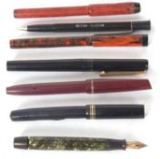 A group of seven various pens to include six fountain pens together with a modern British Telecom