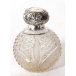 An Edwardian glass scent bottle with hallmarked silver collar and hinged cover, Birmingham 1903,