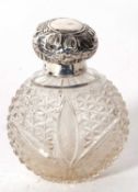 An Edwardian glass scent bottle with hallmarked silver collar and hinged cover, Birmingham 1903,