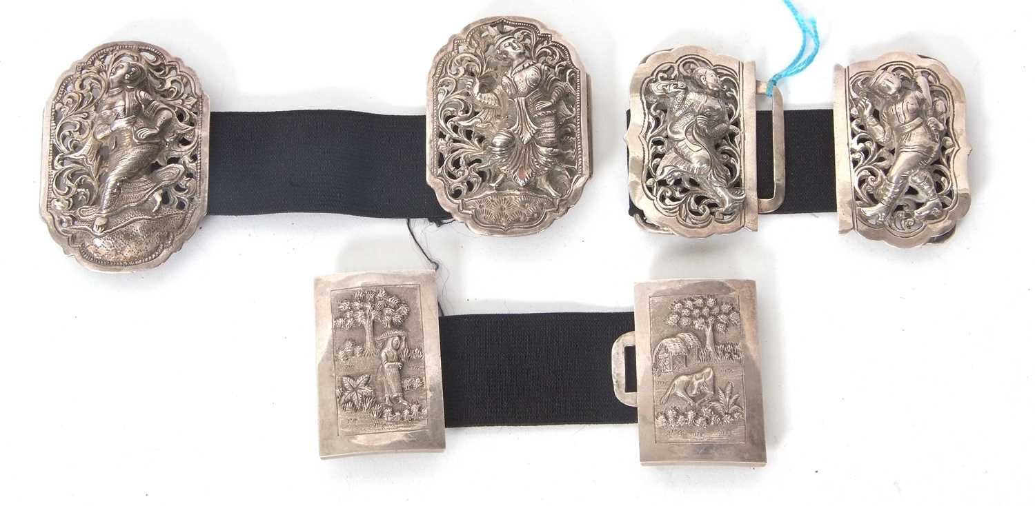 A group of three early 20th Century Eastern white metal two sectional buckles, each panel