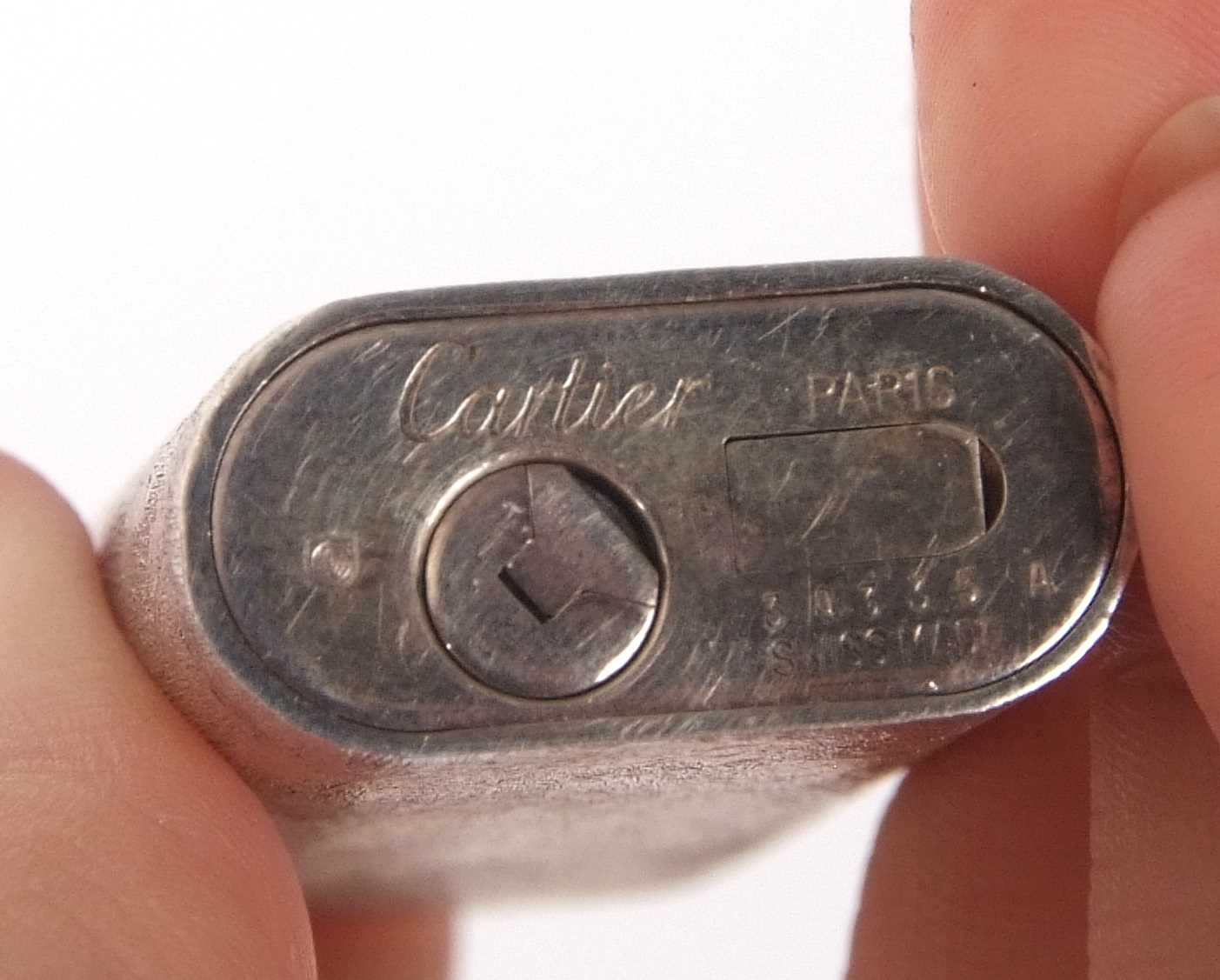 Cased Cartier silver plated lighter, stamped Cartier Paris 34335, Swiss made, 7cm long - Image 5 of 6