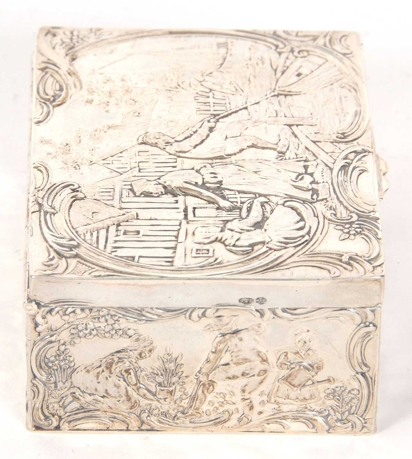 A Dutch white metal box of rectangular form, the lid and sides decorated with figures, boats, nets - Image 5 of 7