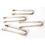 Four pairs of Georgian silver sugar tongs each with bright cut decoration, 140gms