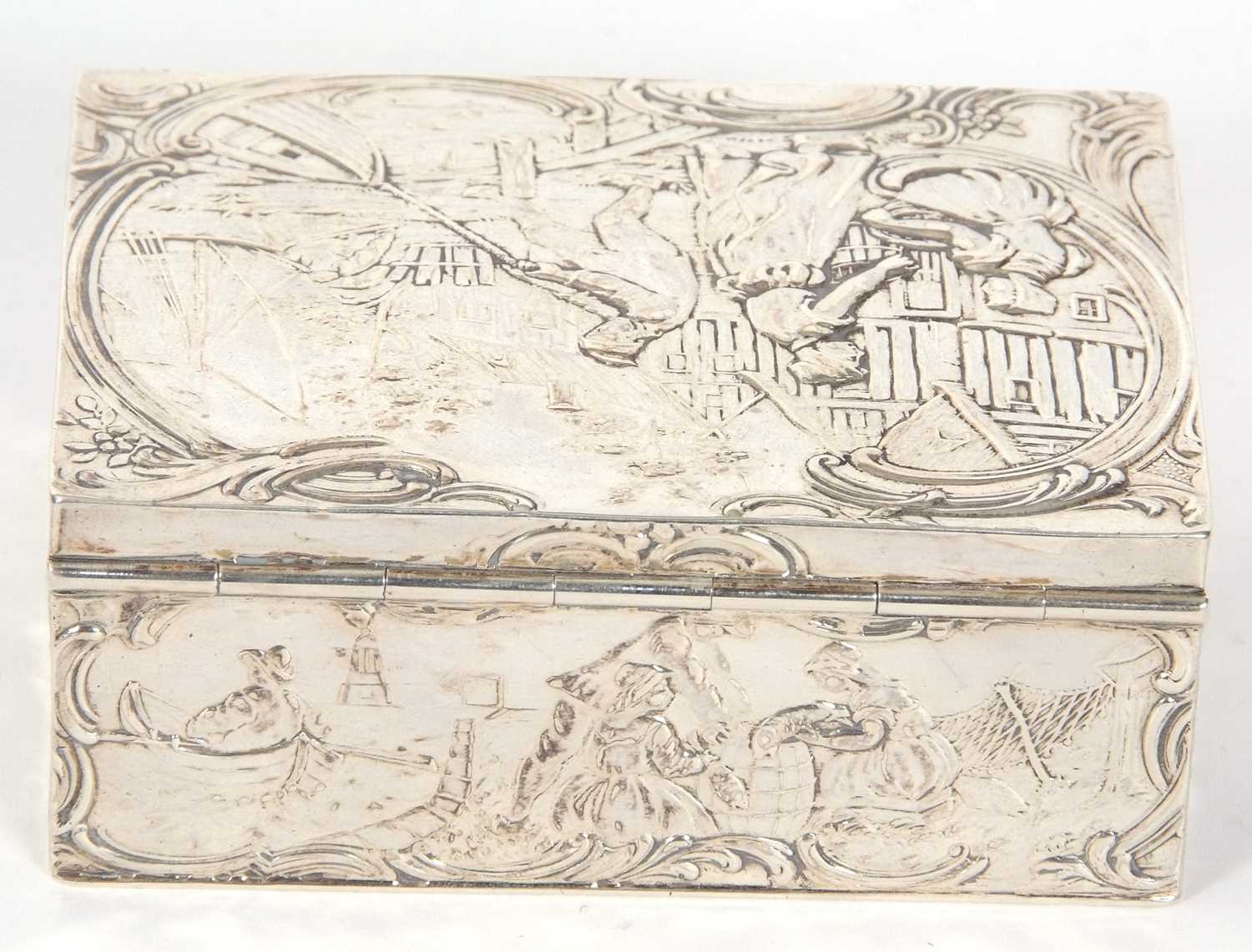 A Dutch white metal box of rectangular form, the lid and sides decorated with figures, boats, nets - Image 4 of 7