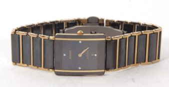 Rado Jubilee wristwatch, the watch has a quartz movement, the black dial has dot hour markers at 12,