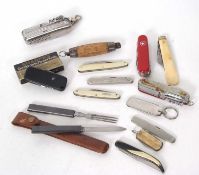 Thirteen assorted Swiss Army type and other pocket knives (13)