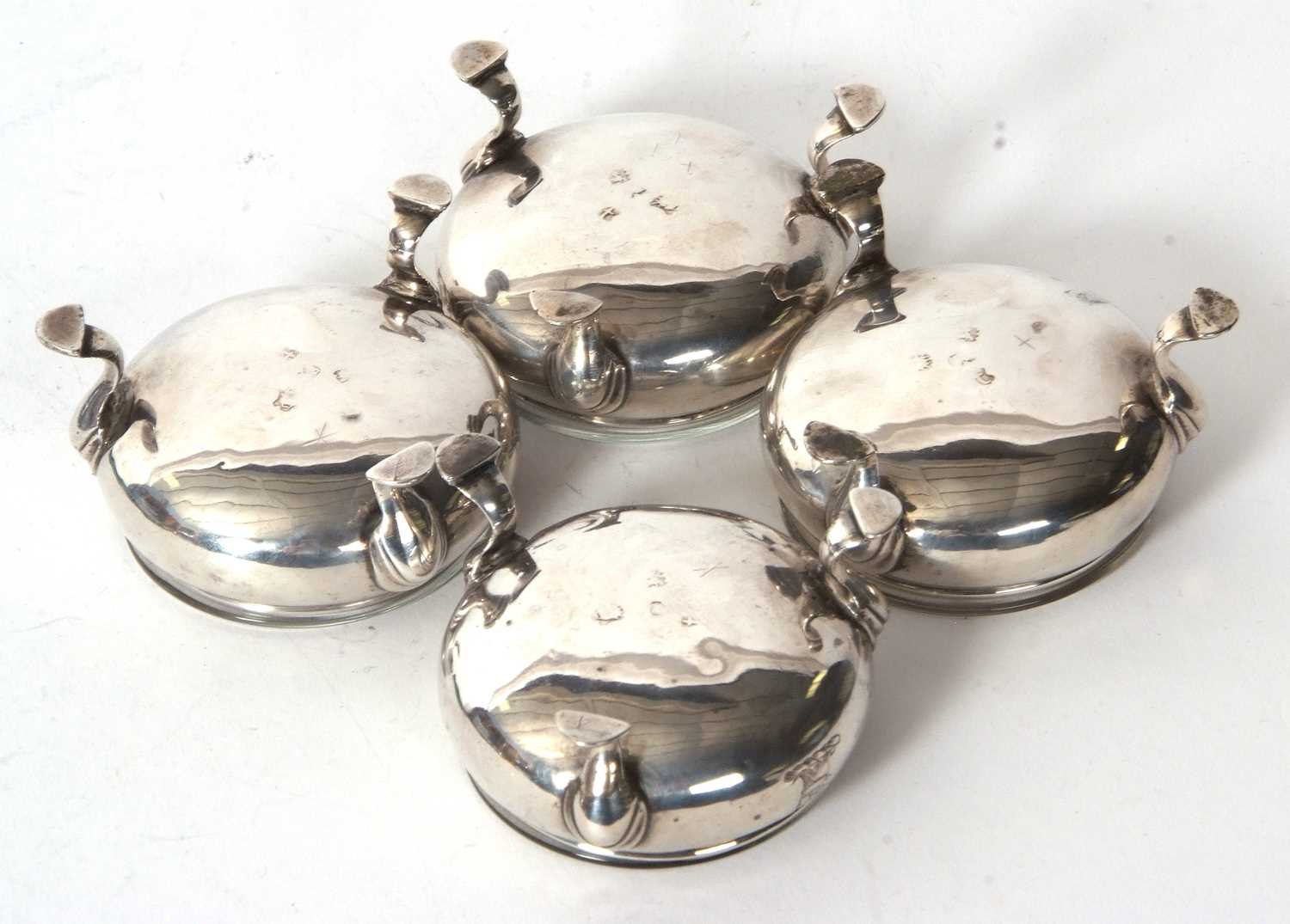 Four George III silver cauldron salts, raised on three hoof feet with later clear glass liners, - Image 4 of 5