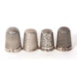 Group of four hallmarked silver thimbles