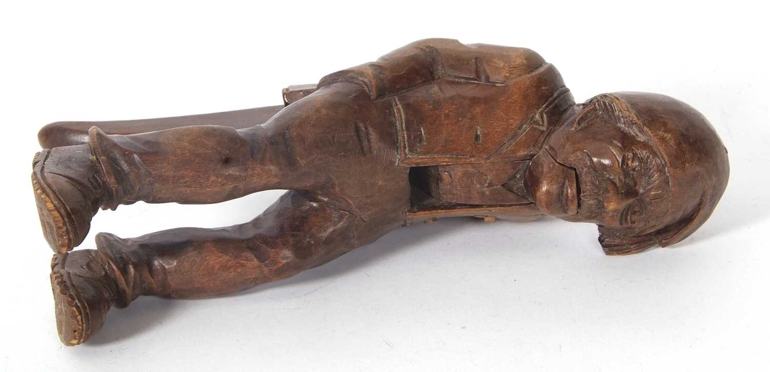 A vintage Black Forest nut cracker, circa 1930 of figural form showing a seated older man with a - Image 5 of 7