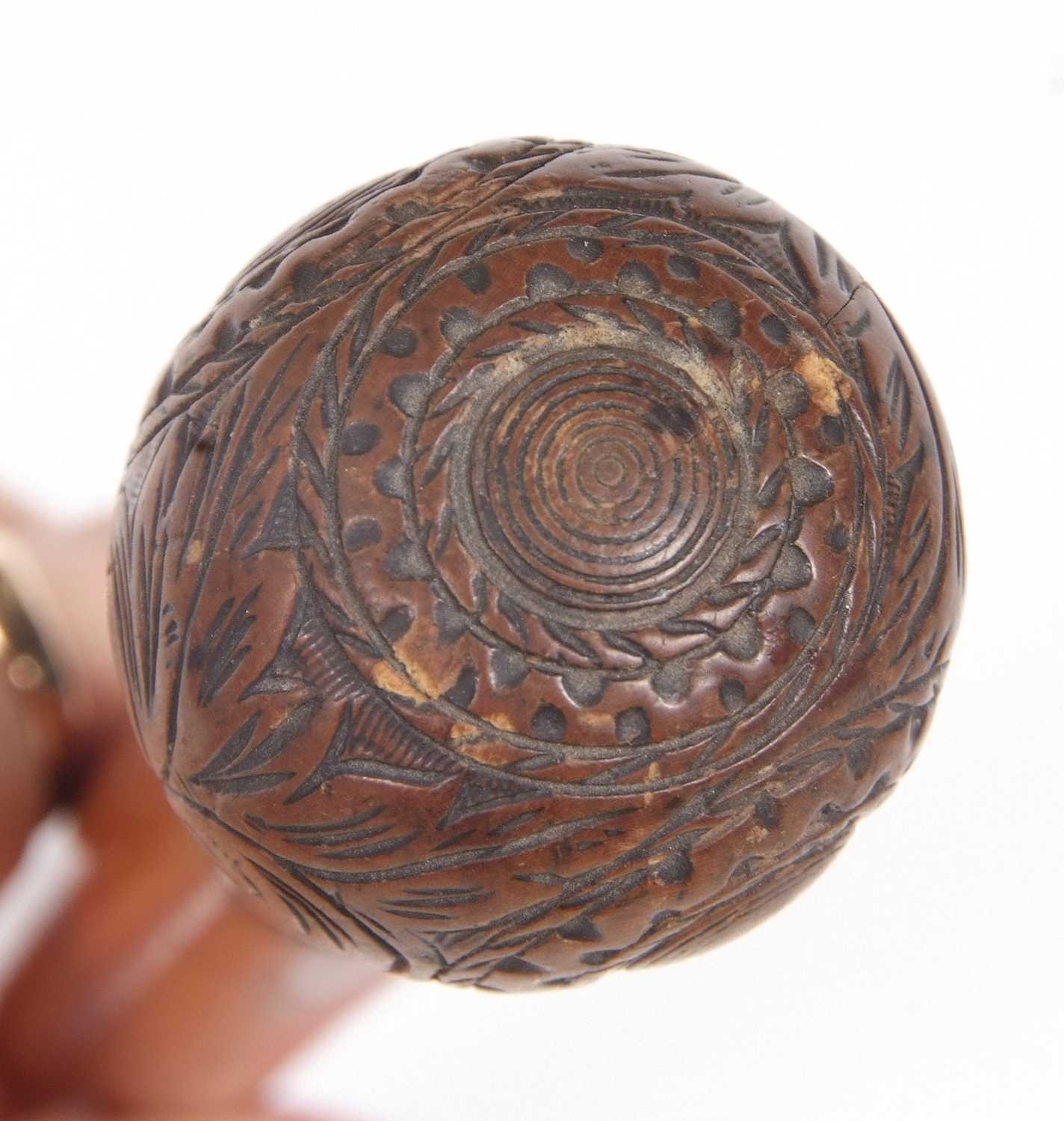 An antique walking stick with ball finial, carved with foliate and geometric designs with a metal - Image 10 of 10